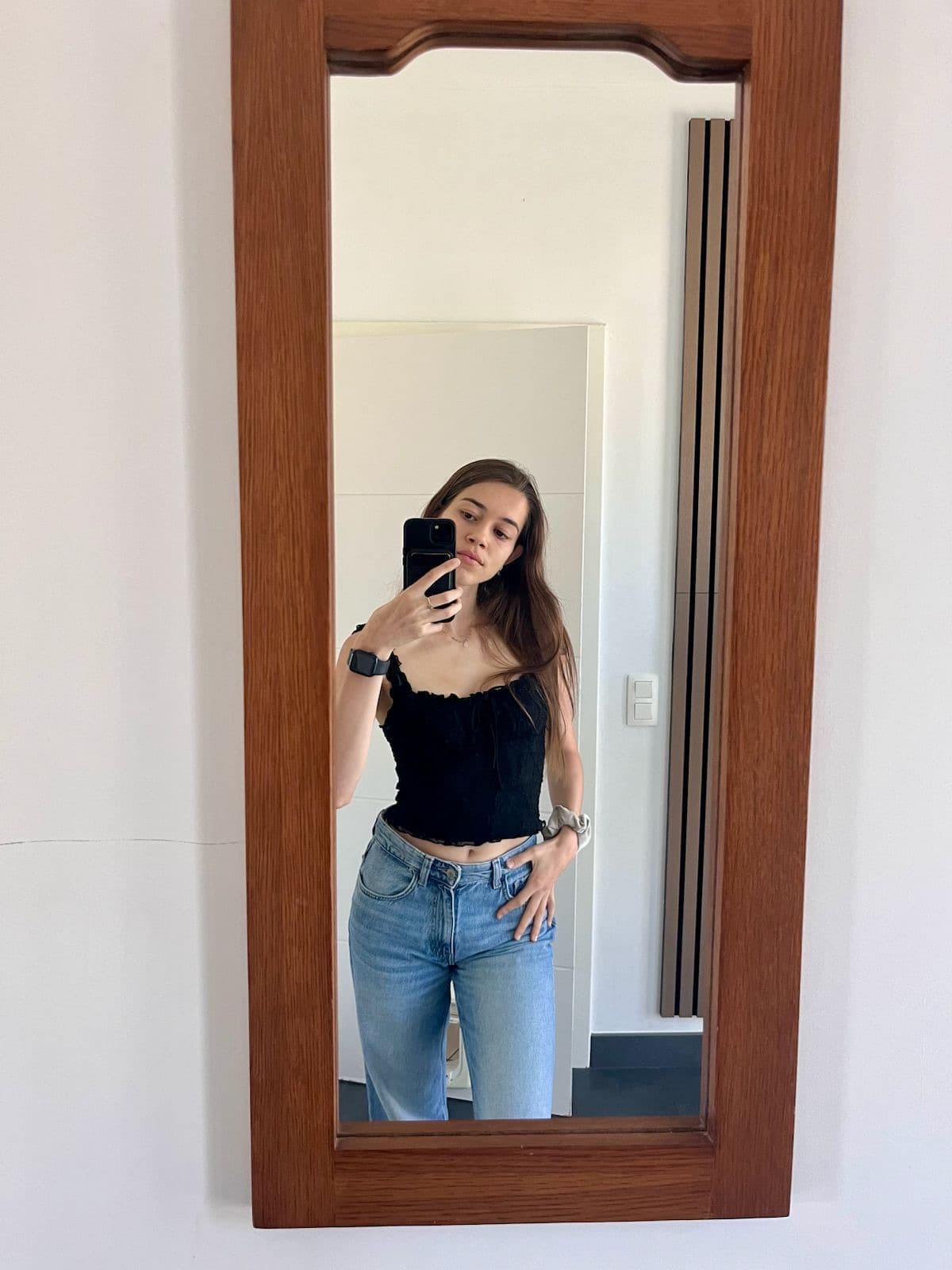 Everyday outfit — black top and blue jeans